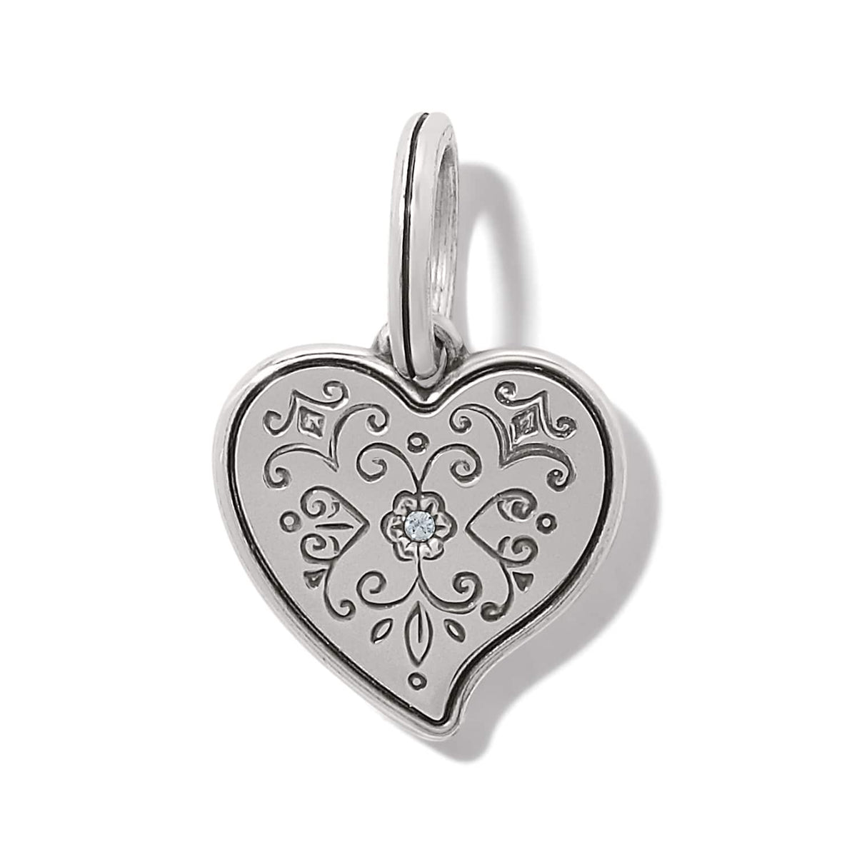 Brighton heart charm pendant with engraved scrollwork, silver-plated finish, and center crystal accent on a white background