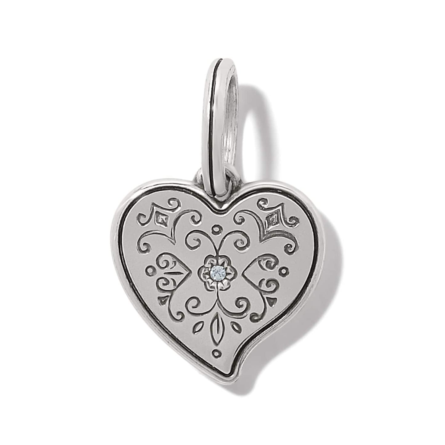 Brighton heart charm pendant with engraved scrollwork, silver-plated finish, and center crystal accent on a white background