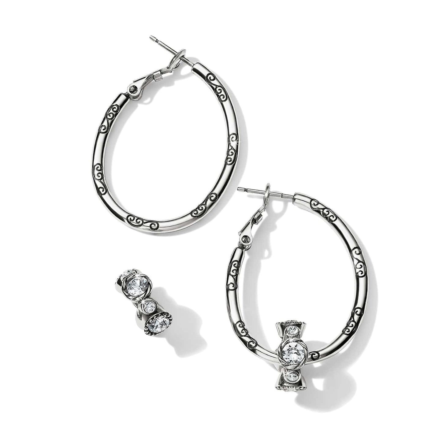 Brighton silver-tone hoop earrings with engraved scroll detail and crystal accent stations on a white background