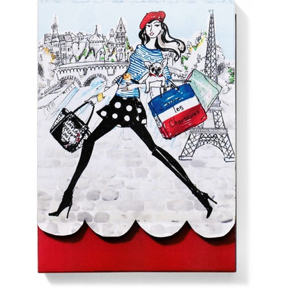 Brighton decorative canvas with illustrated Parisian shopper, Eiffel Tower scene, and scalloped red base on a white background