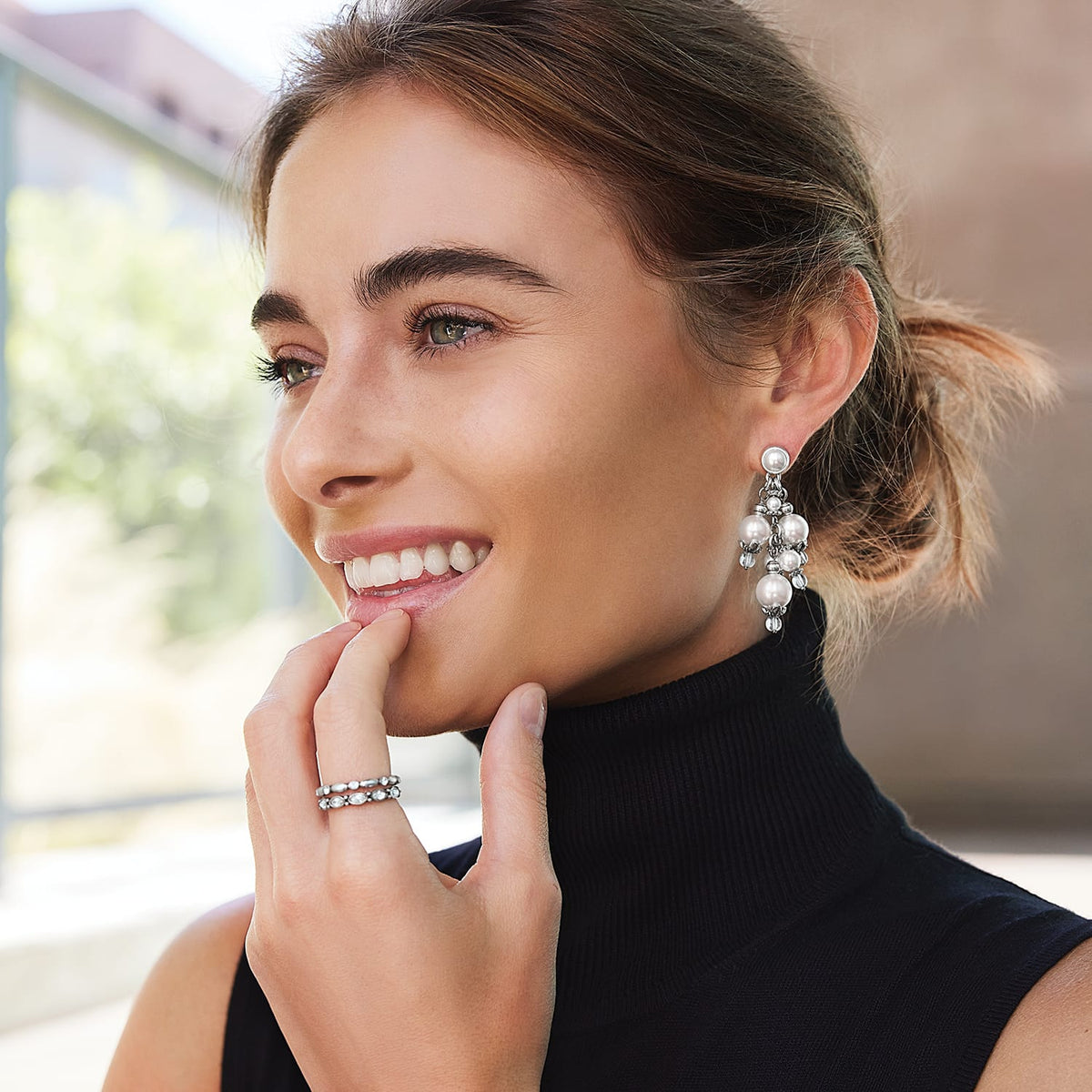 Model wearing Brighton silver-plated drop earrings with fine quality glass pearls and beaded crystal accents