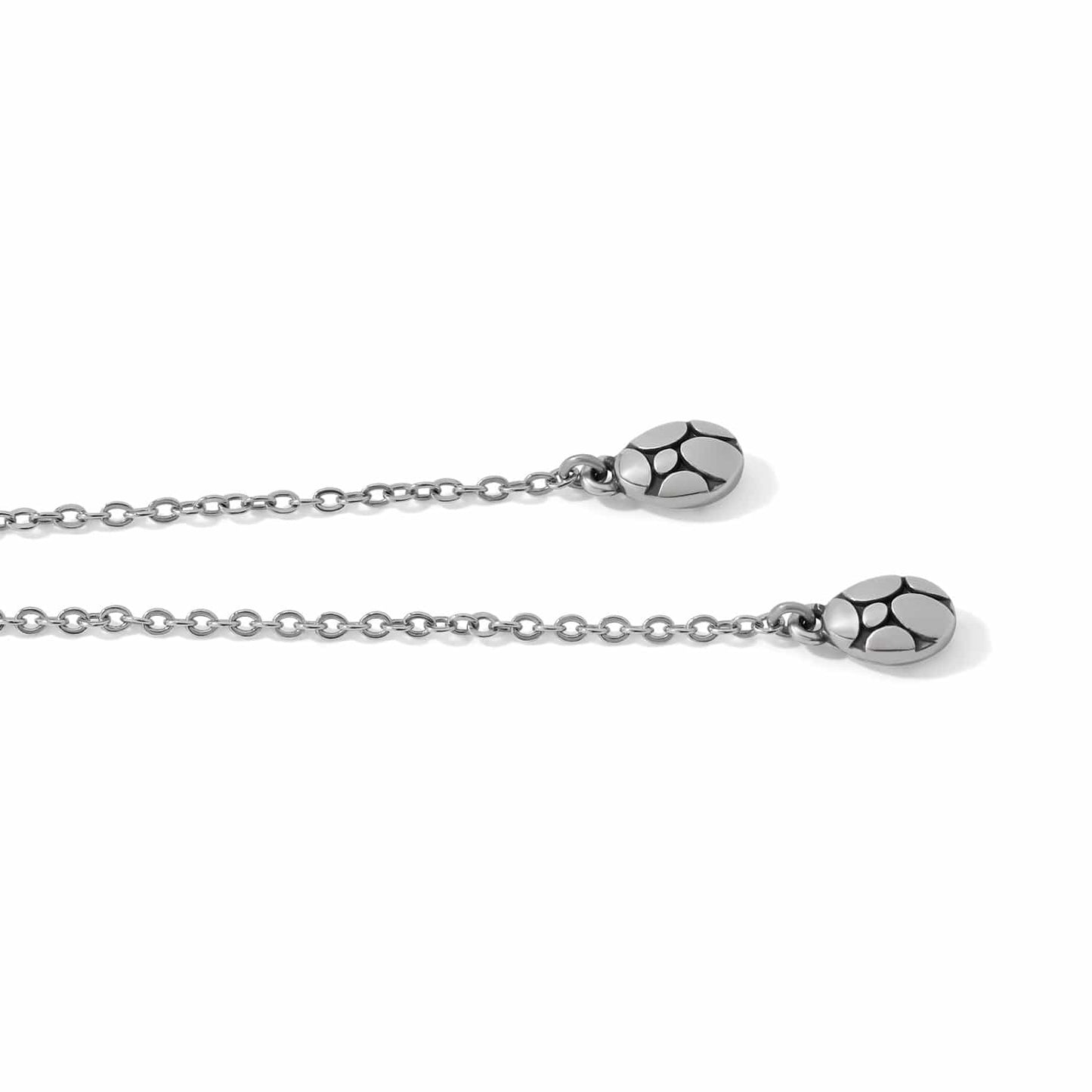 Close-up of Brighton necklace with silver-plated teardrop pendants and delicate cable chain detail
