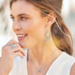 Model wearing Brighton silver-plated drop earrings with beaded teardrop design and coordinating Brighton accessories