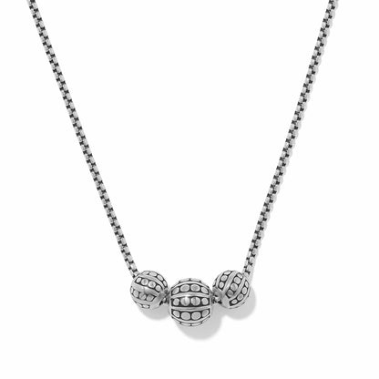Brighton beaded necklace with three silver-plated textured dotted beads on a box chain on a white background