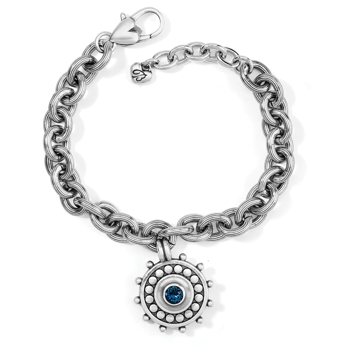 Brighton charm bracelet with silver-plated chain links and round medallion charm featuring blue crystal on a white background