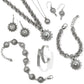 Brighton silver-plated jewelry set styled with chain bracelets and beaded medallion pendants featuring crystal accents on white background
