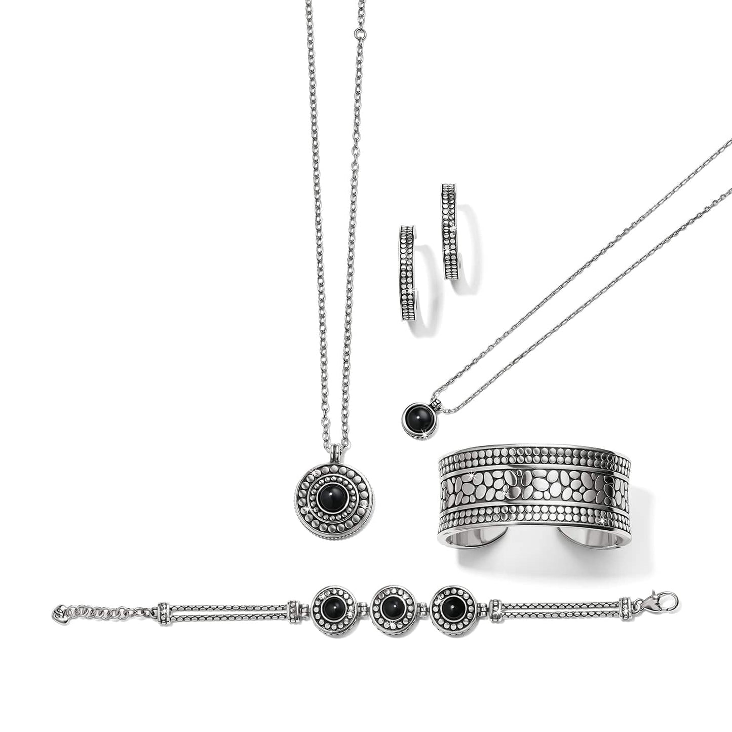 Brighton silver-plated jewelry set styled with black stone pendants, dotted cuff bracelet, hoop earrings, and beaded bracelet on white background