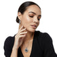 Model wearing a Brighton silver-plated pendant necklace with black stone center paired with matching hoop earrings