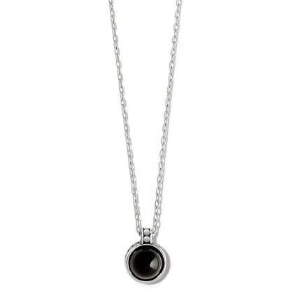 Brighton pendant necklace with round black stone, silver-plated bezel, and delicate cable chain on a white background