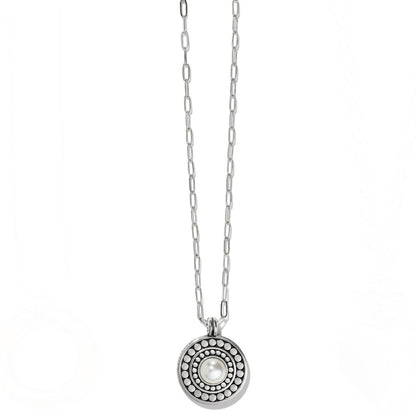 Brighton pendant necklace with glass pearl cabochon center, beaded circular medallion, and two-tone chain on a white background