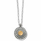 Brighton pendant necklace with two-tone circular medallion, silver dot patterns, and gold center on a white background