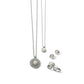 Brighton jewelry set styled with silver-plated pearl pendant necklaces, matching stud earrings, and rings on white background