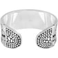 Brighton silver-plated cuff bracelet with textured dotted teardrop end caps and polished interior on a white background