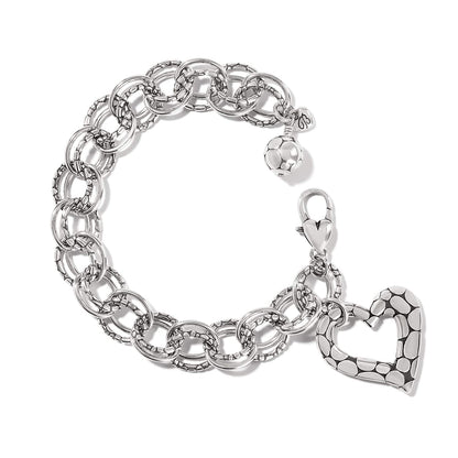 Brighton charm bracelet with silver-plated linked rings, dotted heart charm, and beaded ball accent on a white background
