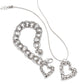 Brighton silver-plated heart pendant necklace styled with a matching link bracelet featuring pebbled texture on white