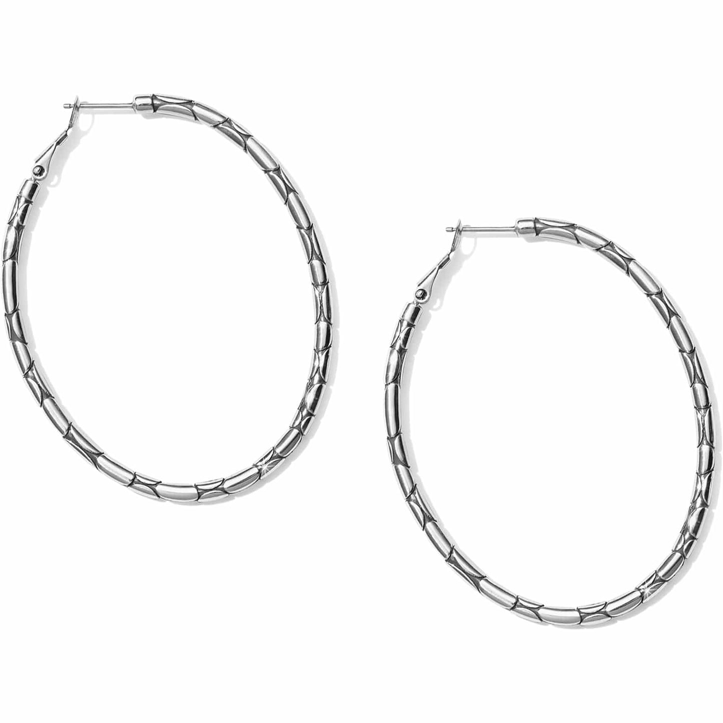 Brighton hoop earrings with silver-plated finish and textured segmented pattern along the oval hoops on a white background