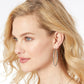 Model wearing a Brighton silver-plated hoop earring with textured patterned finish along the slim oval band