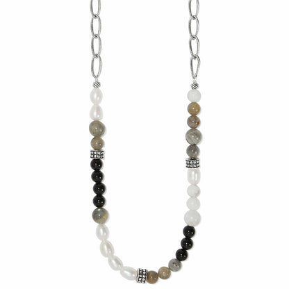 Brighton beaded necklace with pearls, black, gray, and white stones and silver-plated chain on a white background
