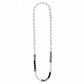 Brighton beaded necklace with pearls, black and gray stones, and silver-plated chain and accents on a white background