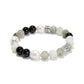 Brighton beaded stretch bracelet with black, white pearl, and gray stones and silver-plated accent beads on a white background