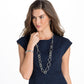 Model wearing a Brighton long silver-plated chain link necklace with coordinating Brighton earrings and bracelet