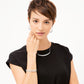 Model wearing a Brighton silver-tone pebbled bar necklace paired with matching hoop earrings and stacked bracelets
