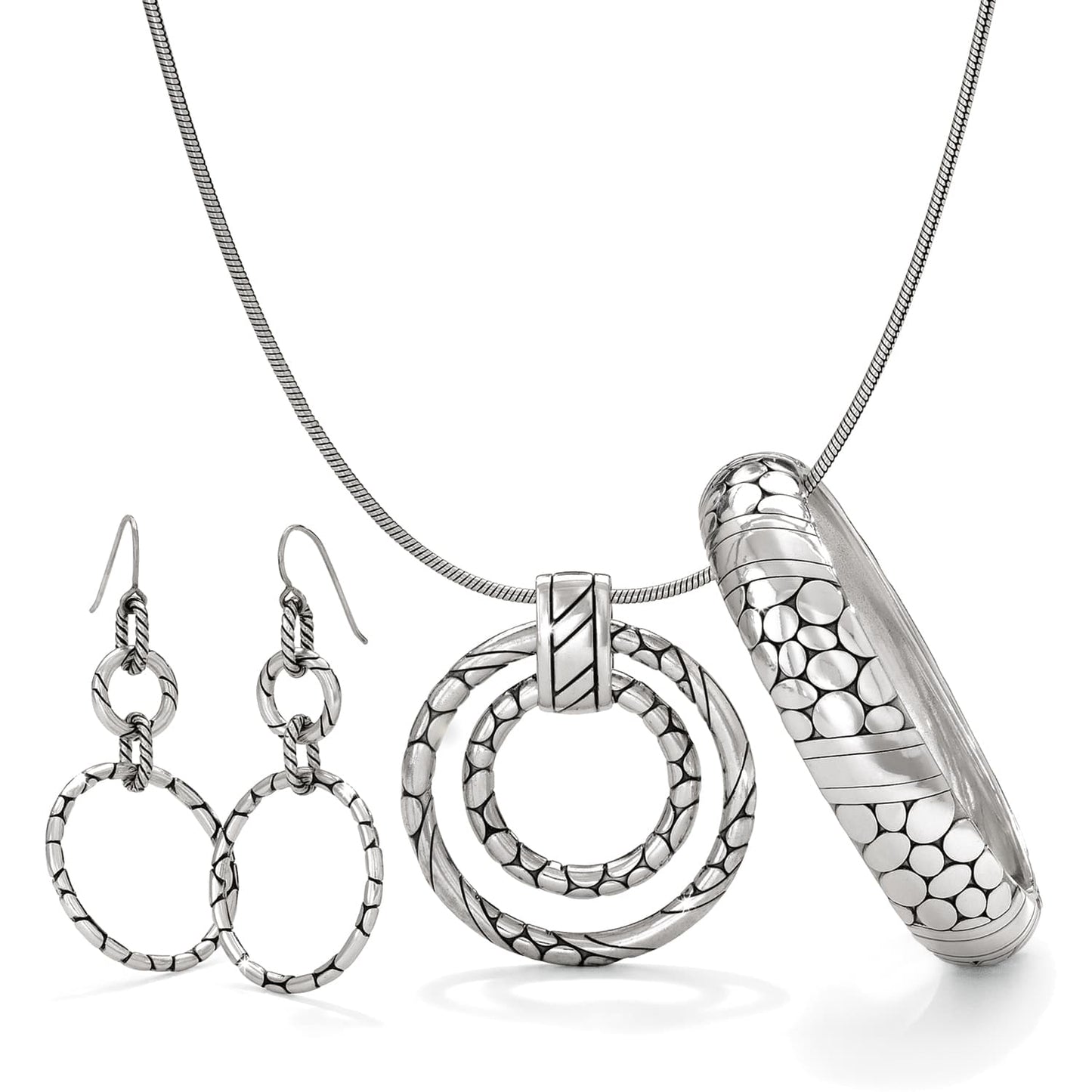 Brighton jewelry set with silver-plated hoop earrings, circular pendant necklace, and textured pebble bangle on a white background