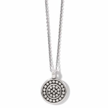 Brighton pendant necklace with silver-plated round medallion featuring concentric dotted circle patterns on a white background