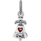 Brighton bell charm with silver-tone scrollwork detailing and red enamel heart accent on a white background