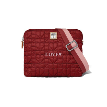 Brighton crossbody handbag in red quilted heart pattern with LOVE embroidery and pink striped strap on a white background