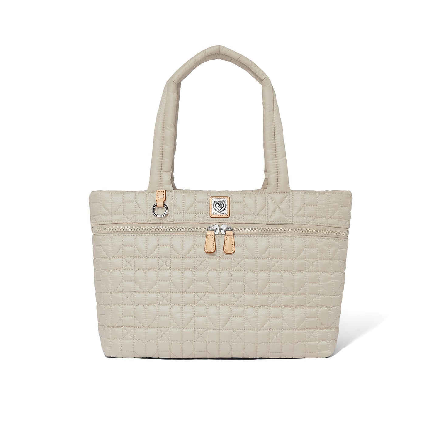 Brighton tote handbag in beige quilted heart pattern with dual handles, front zip pocket, and leather pulls on a white background