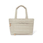 Brighton quilted tote handbag in cream with heart-stitched front pocket and padded top handles on a white background