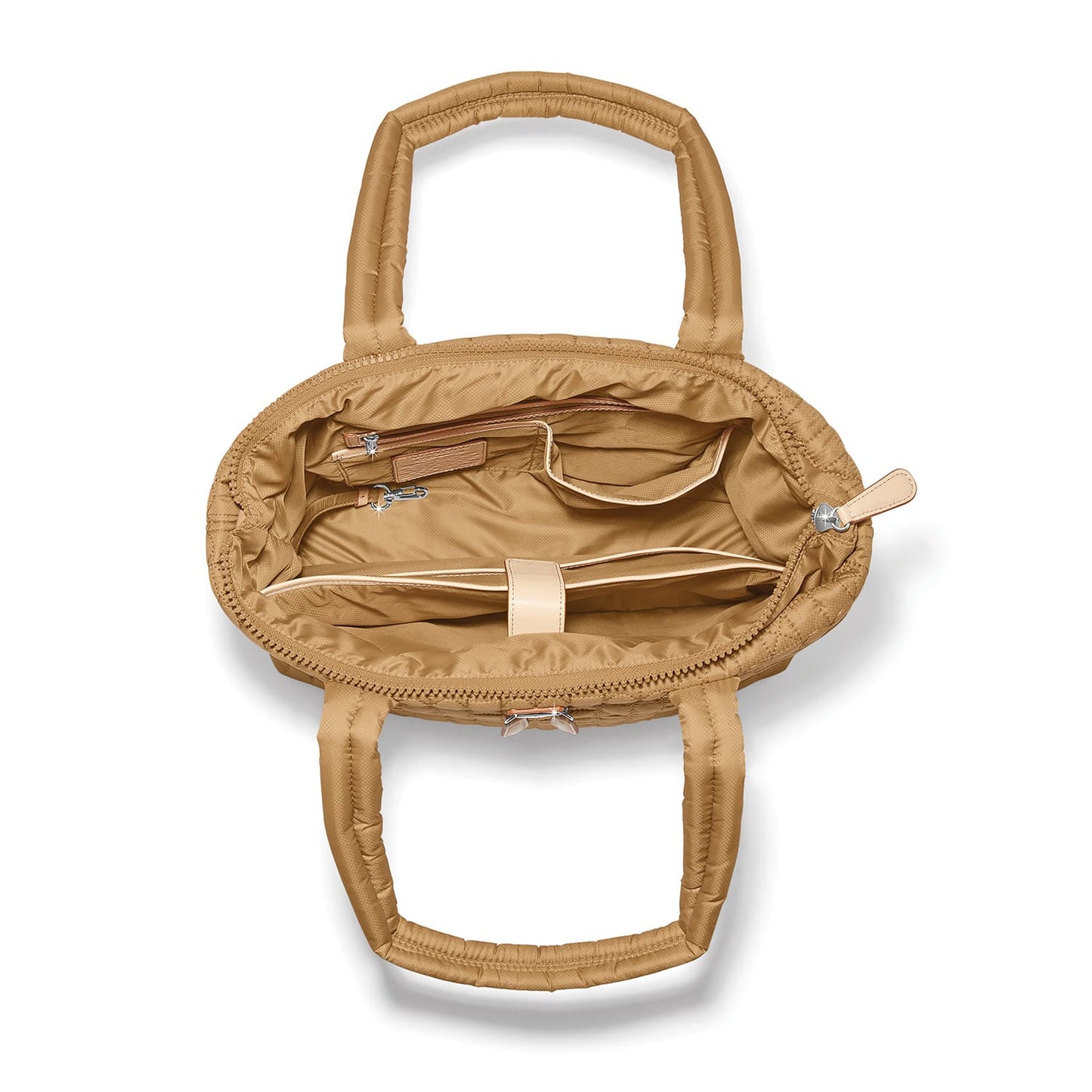 Brighton tan quilted handbag interior view showing zip pocket, slip pockets, and padded handles on a white background