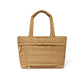 Brighton tote handbag in tan quilted fabric with heart pattern, dual top handles, and front pocket on a white background