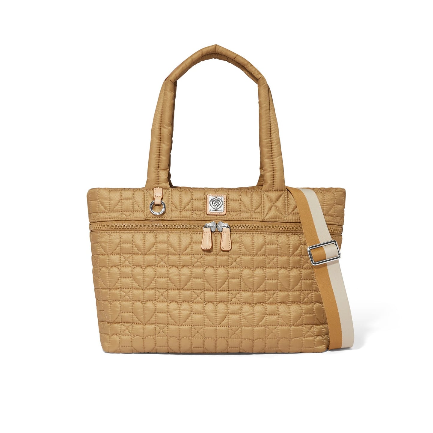 Brighton quilted tote handbag in tan with heart pattern, dual handles, and striped crossbody strap on a white background