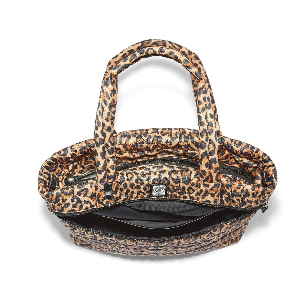 Brighton handbag in leopard print with quilted exterior shown open revealing black interior lining on a white background