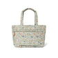 Brighton tote handbag with quilted floral print, dual top handles, and front zip pocket on a white background