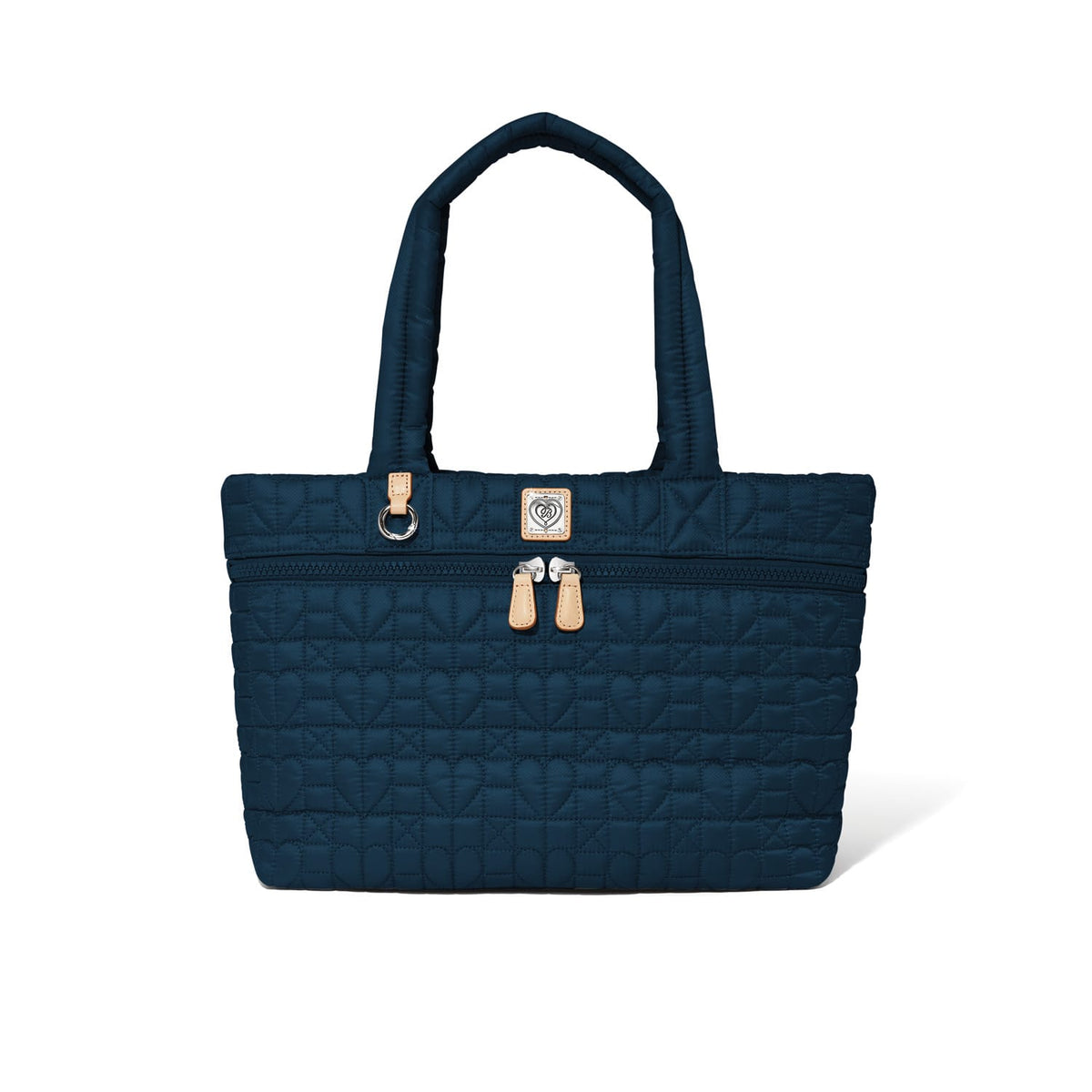 Brighton tote handbag in navy quilted heart pattern with leather trim, dual handles, and zip pocket on a white background