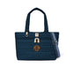 Brighton quilted navy tote handbag with MOM monogram, tan leather accents, and striped crossbody strap on a white background