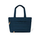 Brighton tote handbag in navy quilted fabric with heart pattern, dual top handles, and front pocket on a white background