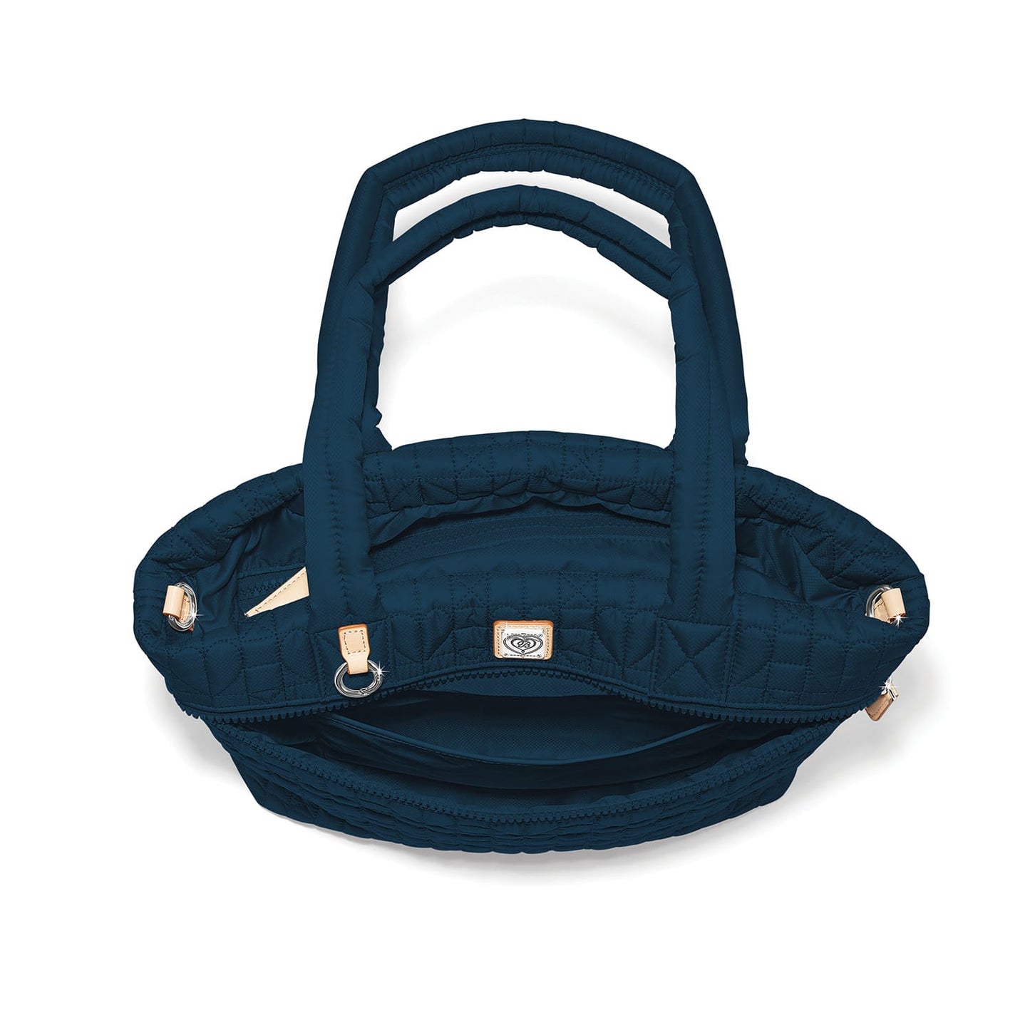 Brighton quilted handbag shown from above with open interior, dual top handles, and leather tabs on a white background