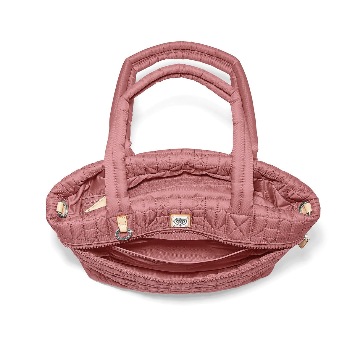 Brighton quilted handbag shown from above with open interior view, dual top handles, and side rings on a white background