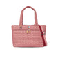 Brighton pink quilted tote handbag with heart pattern, dual handles, and red-pink crossbody strap on a white background