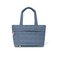 Brighton tote handbag in blue quilted fabric with heart-pattern stitching, dual top handles, and front pocket on a white background