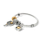 Brighton bangle bracelet with two-tone charms including pickleball paddle, crystal band, and gold heart love padlock on a white background