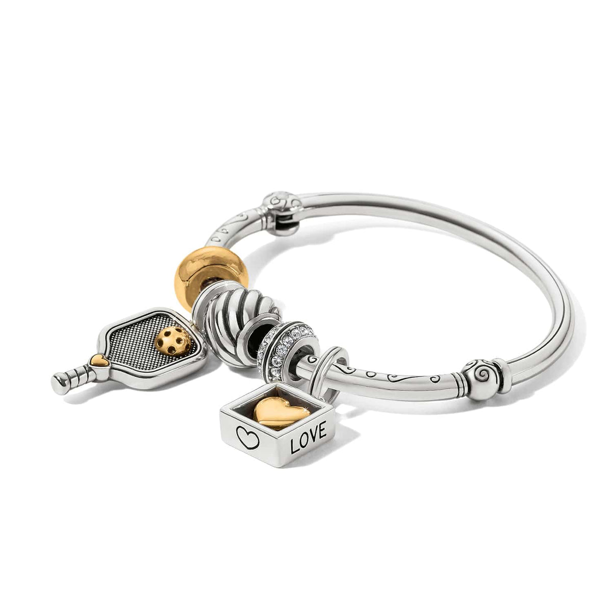 Brighton bangle bracelet with two-tone charms including pickleball paddle, crystal band, and gold heart love padlock on a white background