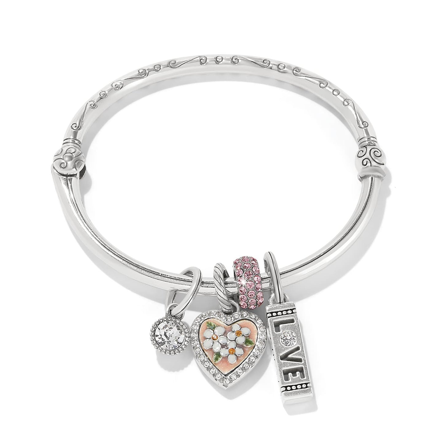 Brighton silver-plated bangle bracelet with crystal, enamel floral heart, pink crystal bead, and love charms on a white background