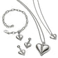 Brighton silver-plated heart jewelry set styled with matching bracelet, earrings, and two necklaces featuring crystal accents