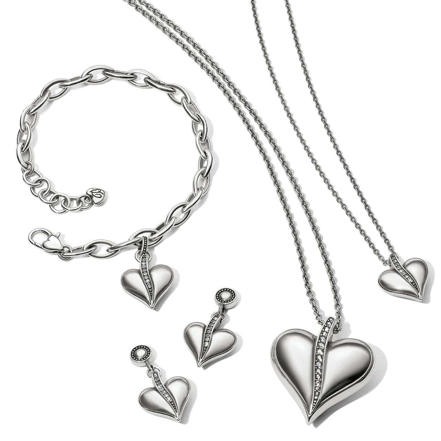 Brighton silver-plated heart jewelry set styled with matching bracelet, earrings, and two necklaces with crystal accents