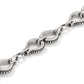 Close-up of Brighton chain with silver-plated horseshoe-shaped links featuring beaded edge detailing and polished finish